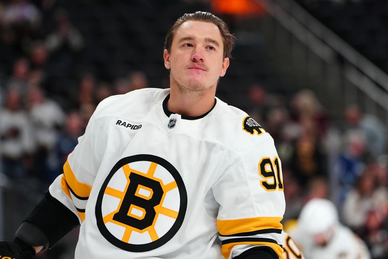 Oct 16, 2025; Las Vegas, Nevada, USA; Boston Bruins defenseman Nikita Zadorov (91) warms up before a game against the Vegas Golden Knights at T-Mobile Arena. Mandatory Credit: Stephen R. Sylvanie-Imagn Images