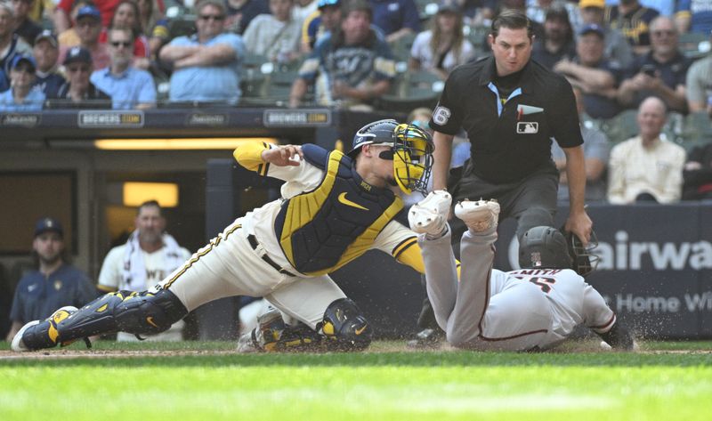 Jun 21, 2023; Milwaukee, Wisconsin, USA; Arizona Diamondbacks designated hitter Pavin Smith (26) slides in safely ahead of the tag by Milwaukee Brewers catcher William Contreras (24) in the sixth inning at American Family Field. Mandatory Credit: Michael McLoone-USA TODAY Sports