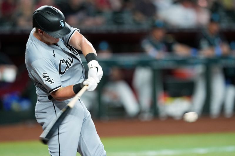 Jun 16, 2024; Phoenix, Arizona, USA; Chicago White Sox first base Andrew Vaughn (25) hits a single against the Arizona Diamondbacks during the first inning at Chase Field. Mandatory Credit: Joe Camporeale-USA TODAY Sports