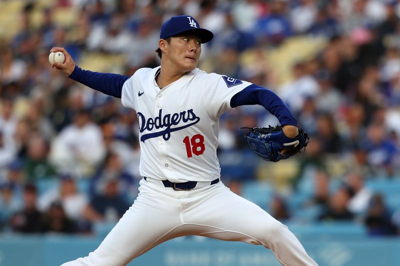 Jun 1, 2024; Los Angeles, California, USA;  Los Angeles Dodgers starting pitcher Yoshinobu Yamamoto (18) pitches during the first inning against the Colorado Rockies at Dodger Stadium. Mandatory Credit: Kiyoshi Mio-USA TODAY Sports