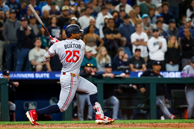 May 30, 2025; Seattle, Washington, USA; Minnesota Twins center fielder Byron Buxton (25) hits a single against the Seattle Mariners during the ninth inning at T-Mobile Park. Mandatory Credit: Joe Nicholson-Imagn Images
