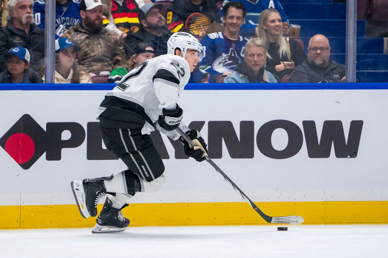 Jan 16, 2025; Vancouver, British Columbia, CAN; Los Angeles Kings forward Kevin Fiala (22) handles the puck against the Vancouver Canucks in the second period at Rogers Arena. Mandatory Credit: Bob Frid-Imagn Images