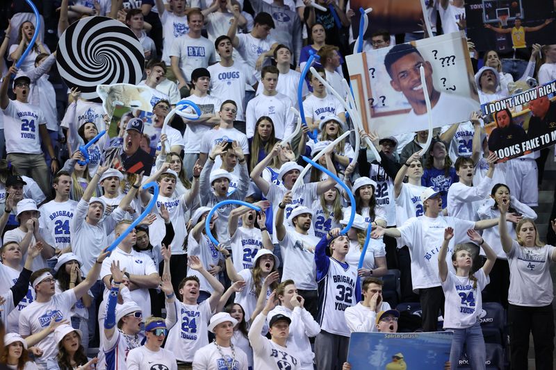 Feb 13, 2024; Provo, Utah, USA; The Brigham Young Cougars student section cheer in the game against the Central Florida Knights during the second half at Marriott Center. Mandatory Credit: Rob Gray-USA TODAY Sports