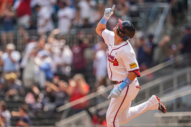 Jun 16, 2024; Cumberland, Georgia, USA; Atlanta Braves third baseman Austin Riley (27) reacts after hitting a game tying two run home run against the Tampa Bay Rays during the eighth inning at Truist Park. Mandatory Credit: Dale Zanine-USA TODAY Sports