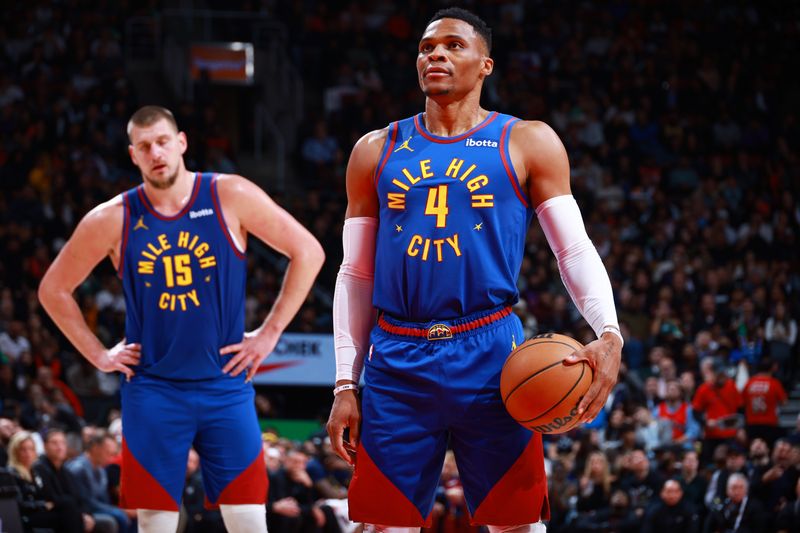 TORONTO, CANADA - OCTOBER 28: Russell Westbrook #4 of the Denver Nuggets prepares to shoot a free throw during the game against the Toronto Raptors on October 28, 2024 at the Scotiabank Arena in Toronto, Ontario, Canada.  NOTE TO USER: User expressly acknowledges and agrees that, by downloading and or using this Photograph, user is consenting to the terms and conditions of the Getty Images License Agreement.  Mandatory Copyright Notice: Copyright 2024 NBAE (Photo by Vaughn Ridley/NBAE via Getty Images)