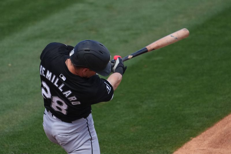 Mar 3, 2024; Tempe, Arizona, USA; Chicago White Sox third baseman Zach Remillard (28) hits home run against the Los Angeles Angels during the third inning at Tempe Diablo Stadium. Mandatory Credit: Joe Camporeale-USA TODAY Sports