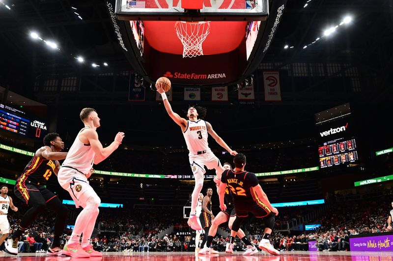 ATLANTA, GA - DECEMBER 8: Julian Strawther #3 of the Denver Nuggets drives to the basket during the game against the Atlanta Hawks on December 8, 2024 at State Farm Arena in Atlanta, Georgia.  NOTE TO USER: User expressly acknowledges and agrees that, by downloading and/or using this Photograph, user is consenting to the terms and conditions of the Getty Images License Agreement. Mandatory Copyright Notice: Copyright 2024 NBAE (Photo by Adam Hagy/NBAE via Getty Images)