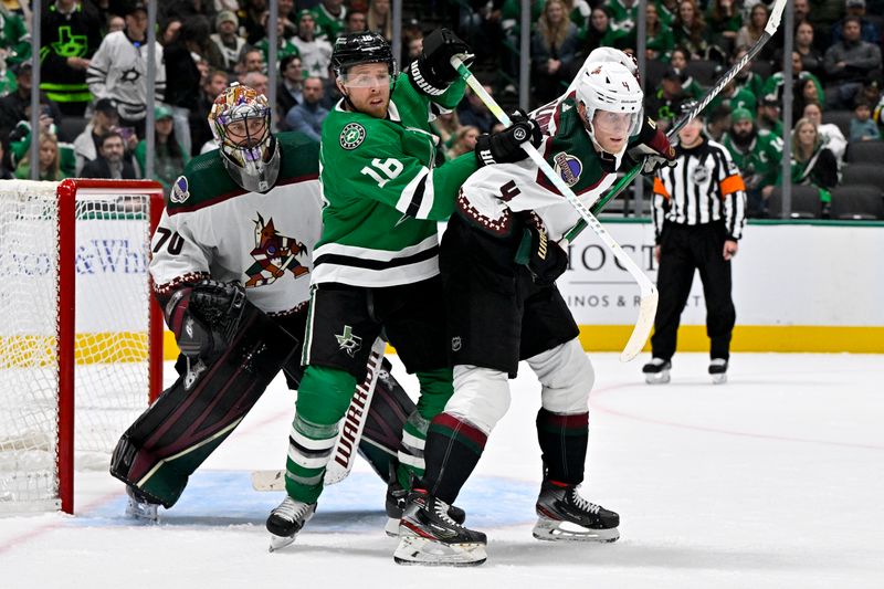 Nov 14, 2023; Dallas, Texas, USA; Dallas Stars center Joe Pavelski (16) battles for position in front of Arizona Coyotes goaltender Karel Vejmelka (70) and defenseman Juuso Valimaki (4) during the second period at the American Airlines Center. Mandatory Credit: Jerome Miron-USA TODAY Sports