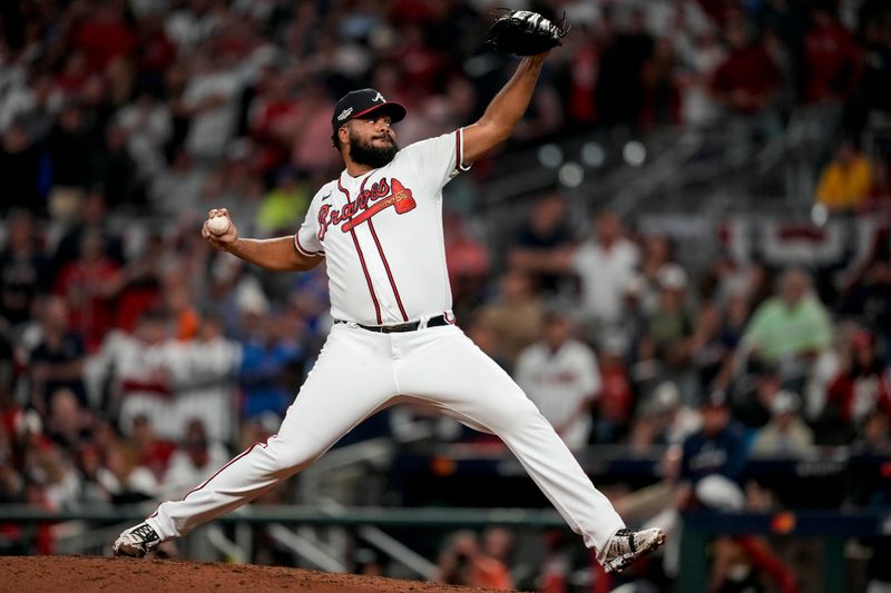 Oct 12, 2022; Atlanta, Georgia, USA; Atlanta Braves relief pitcher Kenley Jansen (74) throws against the Philadelphia Phillies in the ninth inning during game two of the NLDS for the 2022 MLB Playoffs at Truist Park. Mandatory Credit: Dale Zanine-USA TODAY Sports