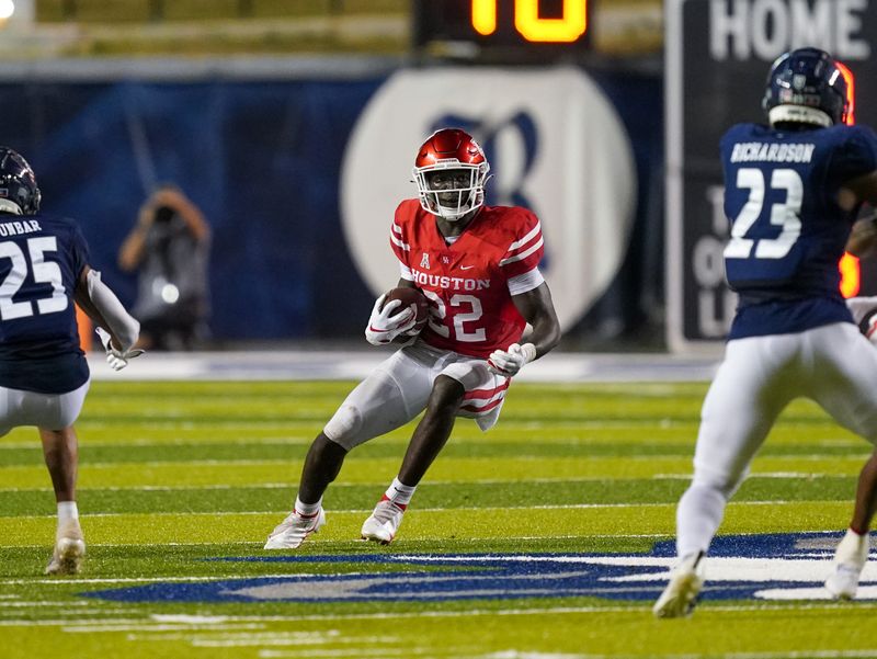 Sep 11, 2021; Houston, Texas, USA;  Houston Cougars running back Alton McCaskill (22) runs the ball in the second half against the Rice Owls at Rice Stadium. Mandatory Credit: Daniel Dunn-USA TODAY Sports