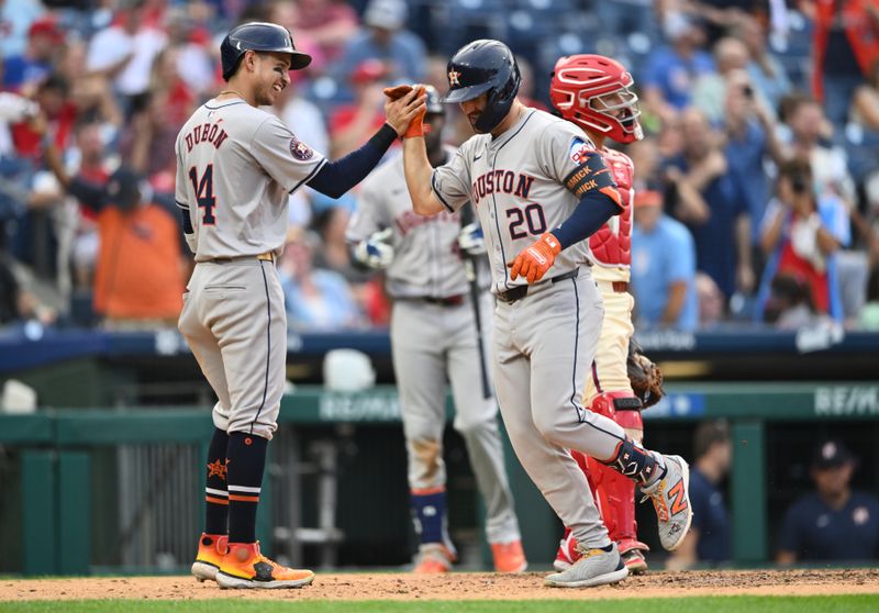 Aug 28, 2024; Philadelphia, Pennsylvania, USA; Houston Astros outfielder Chas McCormick (20) celebrates with outfielder Mauricio Dubon (14) after hitting a two-run home run against the Philadelphia Phillies in the eighth inning at Citizens Bank Park. Mandatory Credit: Kyle Ross-USA TODAY Sports