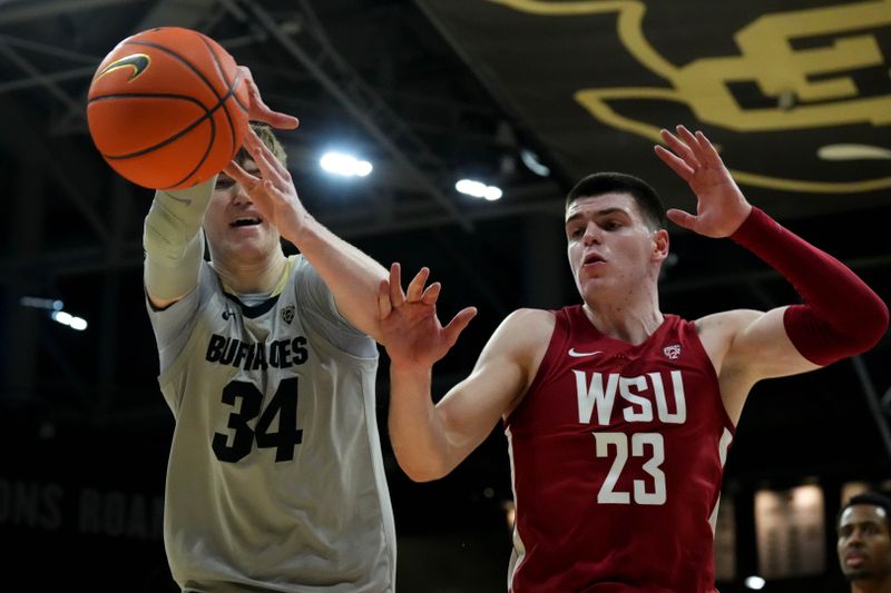 Jan 22, 2023; Boulder, Colorado, USA; Colorado Buffaloes center Lawson Lovering (34) and Washington State Cougars forward Andrej Jakimovski (23) reach for a loose ball in the second half at the CU Events Center. Mandatory Credit: Ron Chenoy-USA TODAY Sports