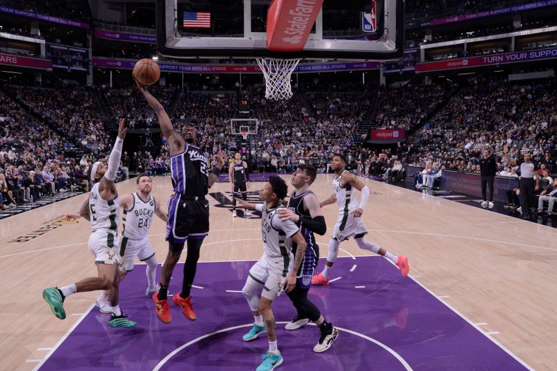 SACRAMENTO, CA - MARCH 22: Keon Ellis #23 of the Sacramento Kings drives to the basket during the game against the Milwaukee Bucks on March 22, 2025 at Golden 1 Center in Sacramento, California. NOTE TO USER: User expressly acknowledges and agrees that, by downloading and or using this Photograph, user is consenting to the terms and conditions of the Getty Images License Agreement. Mandatory Copyright Notice: Copyright 2025 NBAE (Photo by Rocky Widner/NBAE via Getty Images)