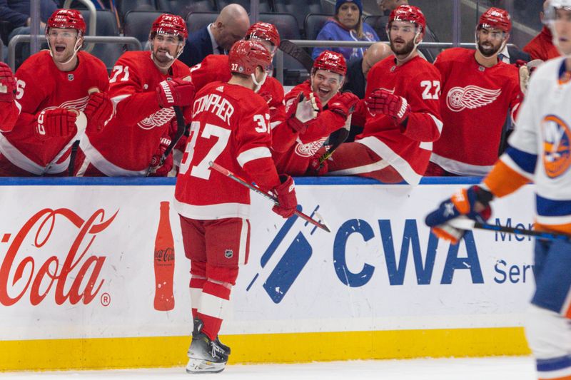 Oct 30, 2023; Elmont, New York, USA; Detroit Red Wings left wing J.T. Compher (37) celebrates his goal against the New York Islanders during the third period at UBS Arena. Mandatory Credit: Thomas Salus-USA TODAY Sports