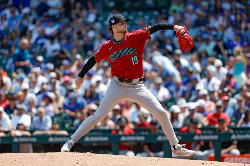 Jul 19, 2024; Chicago, Illinois, USA; Arizona Diamondbacks starting pitcher Ryne Nelson (19) delivers a pitch against the Chicago Cubs during the first inning at Wrigley Field. Mandatory Credit: Kamil Krzaczynski-USA TODAY Sports