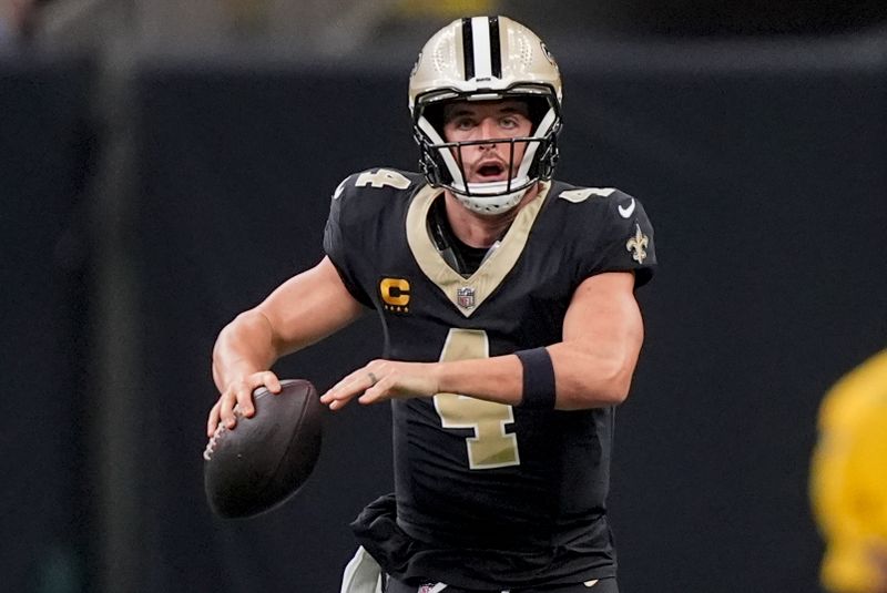 New Orleans Saints quarterback Derek Carr (4) runs with the ball during the second half of an NFL football game against the Carolina Panthers, Sunday, Sept. 8, 2024, in New Orleans. (AP Photo/Gerald Herbert)