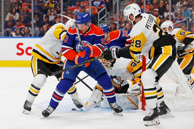 Oct 25, 2024; Edmonton, Alberta, CAN; Edmonton Oilers forward Jeff Skinner (53) looks for a loose puck in front of Pittsburgh Penguins goaltender Joel Blomqvist (30) during the third period at Rogers Place. Mandatory Credit: Perry Nelson-Imagn Images