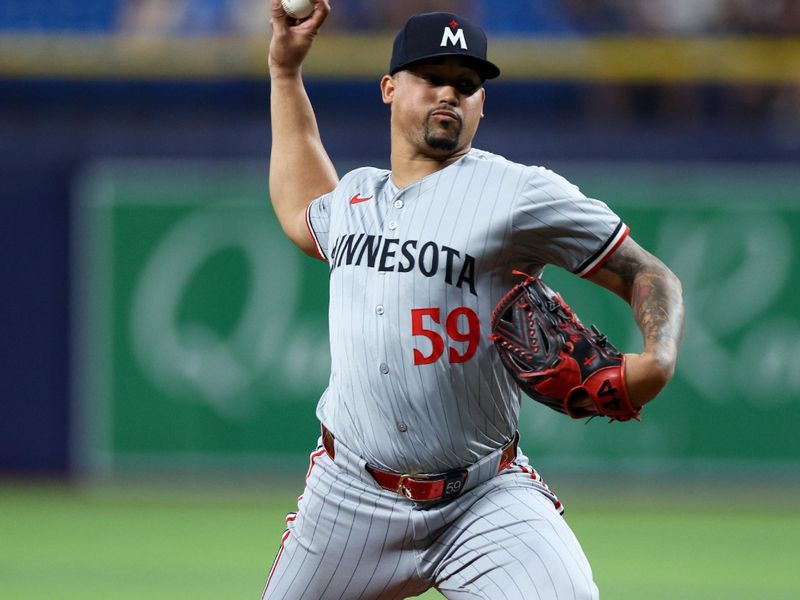 Sep 2, 2024; St. Petersburg, Florida, USA; Minnesota Twins pitcher Jhoan Duran (59) throws a pitch against the Tampa Bay Rays in the ninth inning at Tropicana Field. Mandatory Credit: Nathan Ray Seebeck-USA TODAY Sports