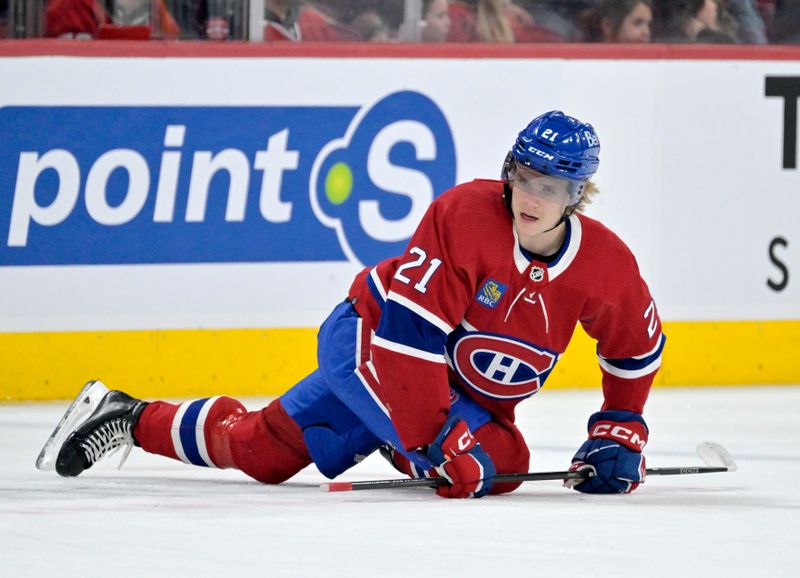 Feb 21, 2024; Montreal, Quebec, CAN; Montreal Canadiens defenseman Kaiden Guhle (21) stretches during the warmup period before the game against the Buffalo Sabres at the Bell Centre. Mandatory Credit: Eric Bolte-USA TODAY Sports