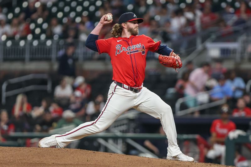 Sep 26, 2025; Cumberland, Georgia, USA; Atlanta Braves pitcher Pierce Johnson (38) pitches the ball against the Pittsburgh Pirates during the ninth inning at Truist Park. Mandatory Credit: Jordan Godfree-Imagn Images