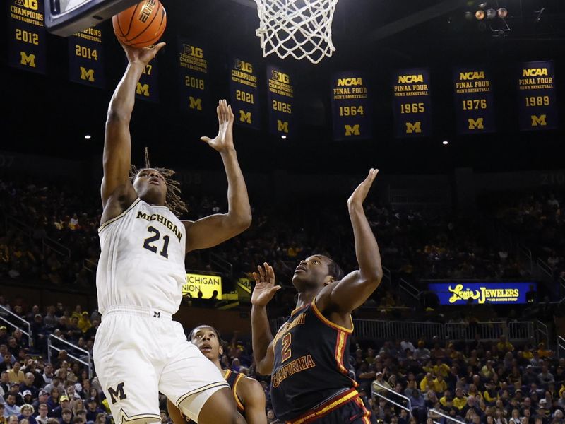 Jan 2, 2026; Ann Arbor, Michigan, USA;  Michigan Wolverines forward Morez Johnson Jr. (21) shoots on Southern California Trojans forward Ezra Ausar (2) in the first half at Crisler Center. Mandatory Credit: Rick Osentoski-Imagn Images