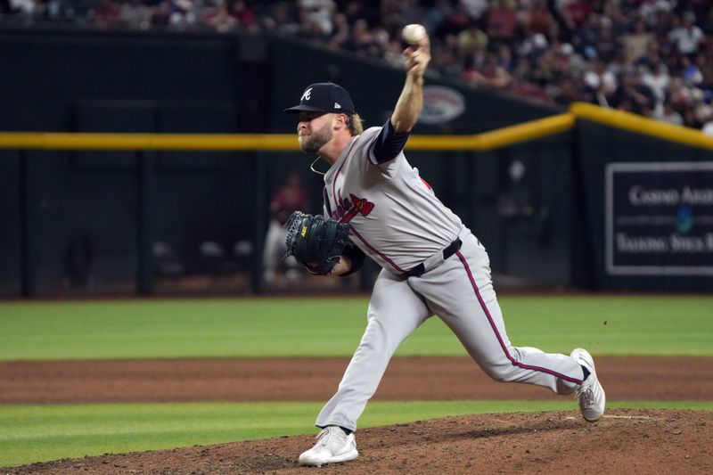 Jul 11, 2024; Phoenix, Arizona, USA; Atlanta Braves pitcher A.J. Minter (33) throws against the Arizona Diamondbacks in the eighth inning at Chase Field. Mandatory Credit: Rick Scuteri-USA TODAY Sports