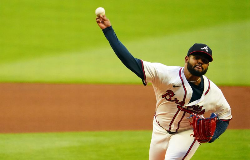 May 13, 2024; Cumberland, Georgia, USA; Atlanta Braves pitcher Reynaldo Lopez (40) fires a pitch against the Chicago Cubs during the first inning at Truist Park. Mandatory Credit: John David Mercer-USA TODAY Sports