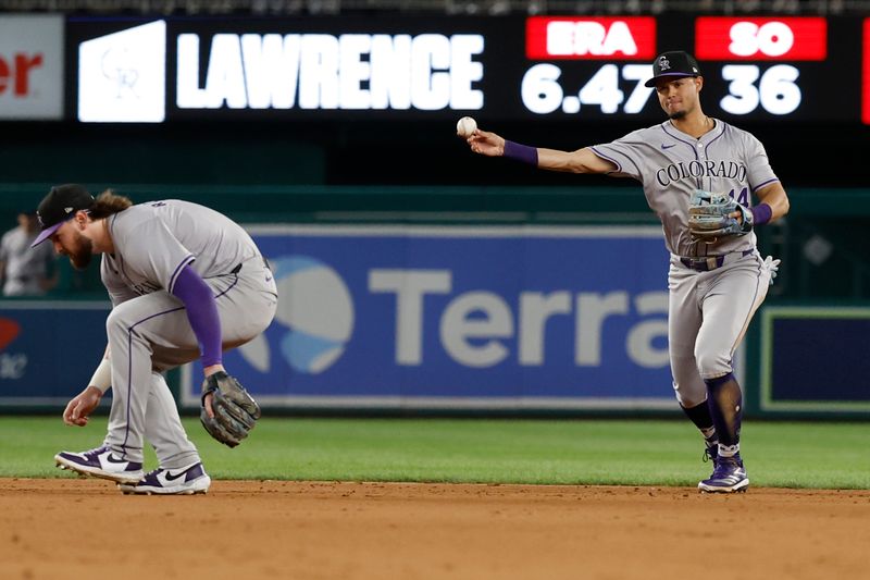 Aug 20, 2024; Washington, District of Columbia, USA; Colorado Rockies shortstop Ezequiel Tovar (14) makes a trow to first base on a ground ball by Washington Nationals third baseman Jose Tena (not pictured) to end the game at Nationals Park. Mandatory Credit: Geoff Burke-USA TODAY Sports