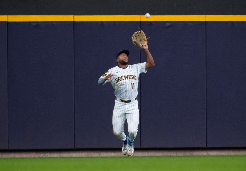 May 4, 2025; Milwaukee, Wisconsin, USA; Milwaukee Brewers outfielder Jackson Chourio (11) catches a fly ball in the ninth inning against the / at American Family Field. Mandatory Credit: Michael McLoone-Imagn Images
