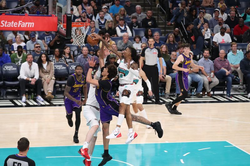 MEMPHIS, TN - NOVEMBER 6: Ja Morant #12 of the Memphis Grizzlies blocks the ball during the game against the Los Angeles Lakers on November 6, 2024 at FedExForum in Memphis, Tennessee. NOTE TO USER: User expressly acknowledges and agrees that, by downloading and or using this photograph, User is consenting to the terms and conditions of the Getty Images License Agreement. Mandatory Copyright Notice: Copyright 2024 NBAE (Photo by Joe Murphy/NBAE via Getty Images)