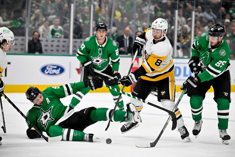 Mar 22, 2024; Dallas, Texas, USA; Dallas Stars center Tyler Seguin (91) is tripped up in front of center Matt Duchene (95) and Pittsburgh Penguins left wing Michael Bunting (8) during the third period at the American Airlines Center. Mandatory Credit: Jerome Miron-USA TODAY Sports