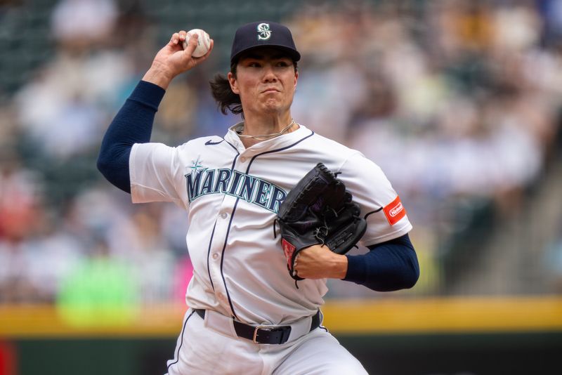 Aug 27, 2025; Seattle, Washington, USA;  Seattle Mariners starter Bryan Woo (22) delivers a pitch against the San Diego Padres at T-Mobile Park. Mandatory Credit: Stephen Brashear-Imagn Images
