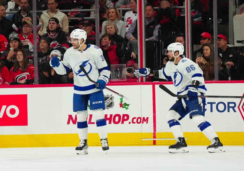 Nov 24, 2023; Raleigh, North Carolina, USA; Tampa Bay Lightning left wing Brandon Hagel (38) celebrates his goal against the Carolina Hurricanes during the third period at PNC Arena. Mandatory Credit: James Guillory-USA TODAY Sports