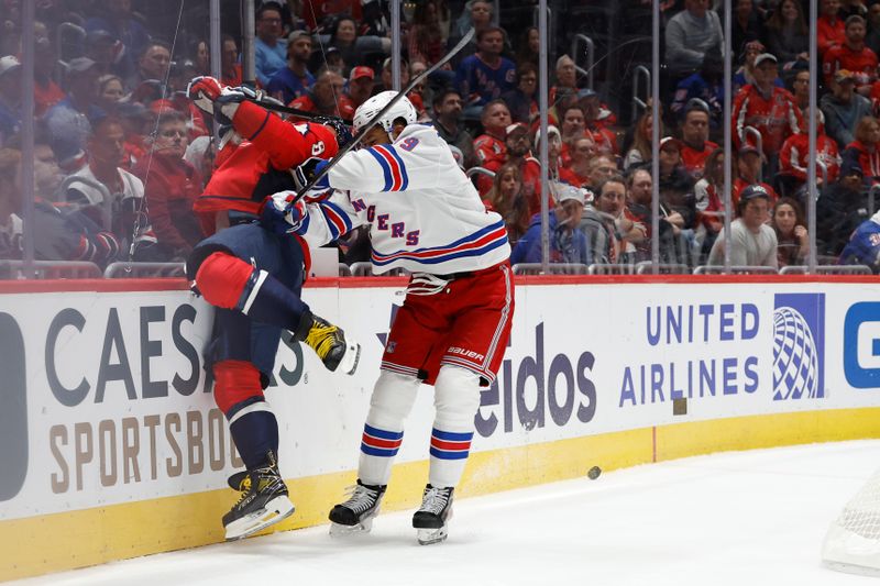 Oct 29, 2024; Washington, District of Columbia, USA; New York Rangers defenseman K'Andre Miller (79) checks Washington Capitals left wing Alex Ovechkin (8) in the third period at Capital One Arena. Mandatory Credit: Geoff Burke-Imagn Images