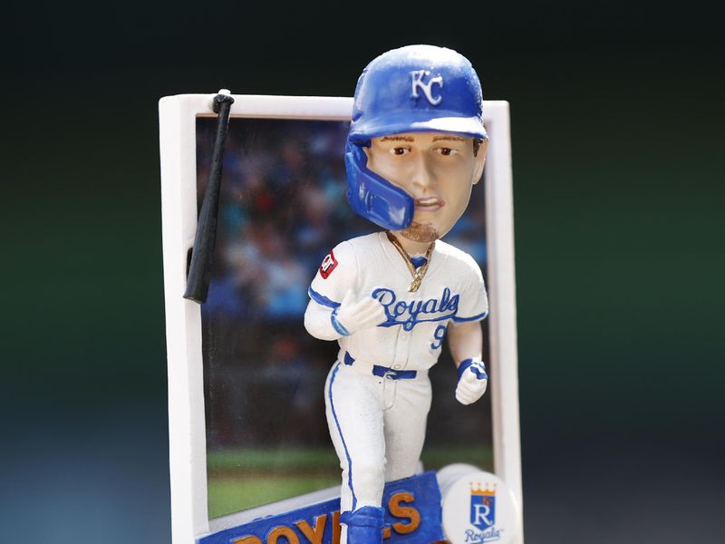 Apr 6, 2025; Kansas City, Missouri, USA;  Bobblehead  of Kansas City Royals first base Vinnie Pasquantino (9) was given out today at Kauffman Stadium. Mandatory Credit: Gary Rohman-Imagn Images