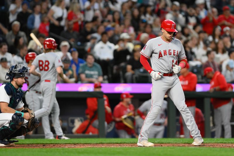 Sep 11, 2023; Seattle, Washington, USA; Los Angeles Angels catcher Logan O'Hoppe (14) touches home plate after hitting a home run against the Seattle Mariners during the fourth inning at T-Mobile Park. Mandatory Credit: Steven Bisig-USA TODAY Sports