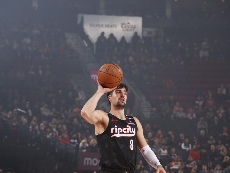 PORTLAND, OR - JANUARY 11:  Deni Avdija #8 of the Portland Trail Blazers handles the ball during the game against the Miami Heat on January 11, 2025 at the Moda Center Arena in Portland, Oregon. NOTE TO USER: User expressly acknowledges and agrees that, by downloading and or using this photograph, user is consenting to the terms and conditions of the Getty Images License Agreement. Mandatory Copyright Notice: Copyright 2025 NBAE (Photo by Cameron Browne/NBAE via Getty Images)