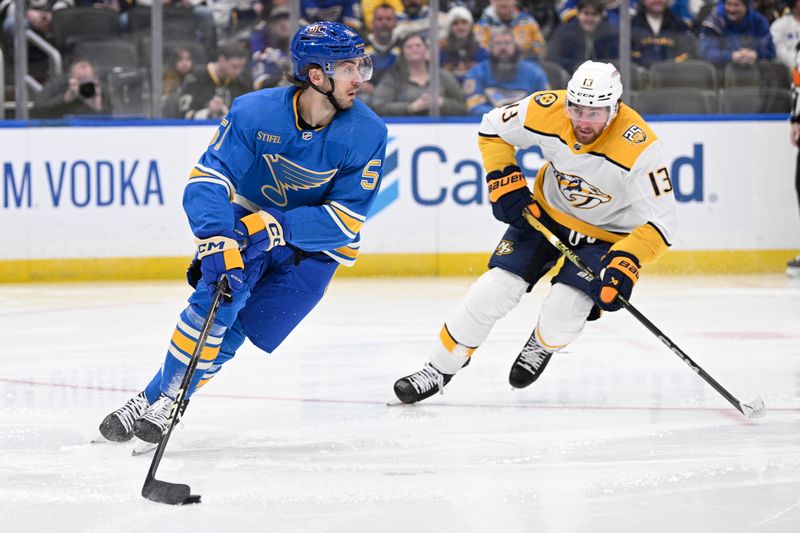 Feb 17, 2024; St. Louis, Missouri, USA; Nashville Predators center Yakov Trenin (13) pressures St. Louis Blues defenseman Matthew Kessel (51) during the third period at Enterprise Center. Mandatory Credit: Jeff Le-USA TODAY Sports