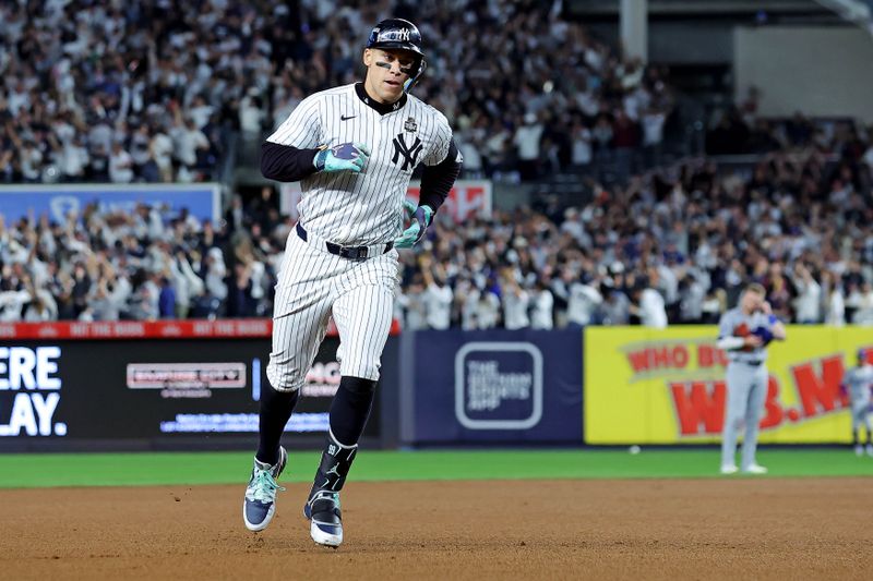 Oct 30, 2024; New York, New York, USA; New York Yankees outfielder Aaron Judge (99) runs the bases after hitting a three run home run during the first inning against the Los Angeles Dodgers in game four of the 2024 MLB World Series at Yankee Stadium. Mandatory Credit: Brad Penner-Imagn Images