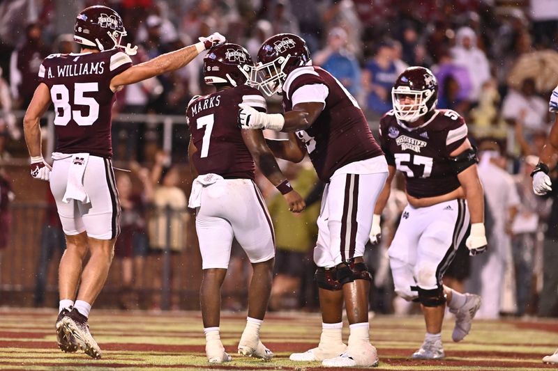 Sep 3, 2022; Starkville, Mississippi, USA;  Mississippi State Bulldogs running back Jo'quavious Marks (7) reacts with teammates after a touchdown against the Memphis Tigers during the second quarter at Davis Wade Stadium at Scott Field. Mandatory Credit: Matt Bush-USA TODAY Sports