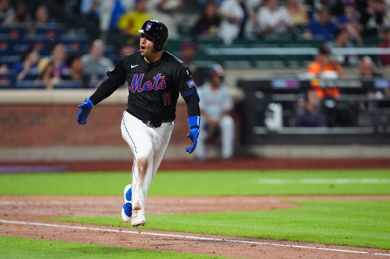 Jul 10, 2024; New York City, New York, USA; New York Mets second baseman Jose Iglesias (11) reacts to hitting a RBI single against the Washington Nationals during the sixth inning at Citi Field. Mandatory Credit: Gregory Fisher-USA TODAY Sports