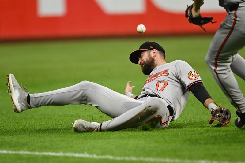 Aug 2, 2024; Cleveland, Ohio, USA; Baltimore Orioles left fielder Colton Cowser (17) can not catch an RBI double hit by Cleveland Guardians first baseman Josh Naylor (not pictured) during the fifth inning at Progressive Field. Mandatory Credit: Ken Blaze-USA TODAY Sports