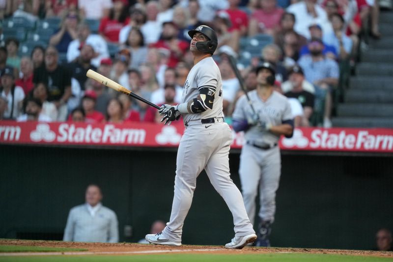 Jul 18, 2023; Anaheim, California, USA; New York Yankees second baseman Gleyber Torres (25) hits a home run in the second inning against the Los Angeles Angels at Angel Stadium. Mandatory Credit: Kirby Lee-USA TODAY Sports