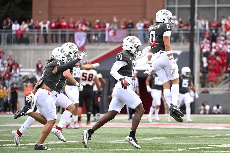 Sep 23, 2023; Pullman, Washington, USA; Washington State Cougars defensive back Sam Lockett III (0) celebrates after intercepting against the Oregon State Beavers in the first half at Gesa Field at Martin Stadium. Mandatory Credit: James Snook-USA TODAY Sports