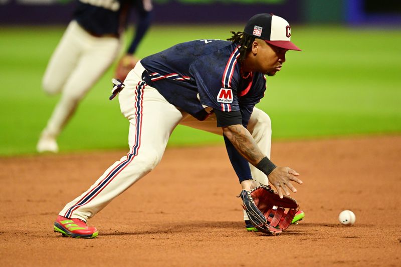 Jul 19, 2024; Cleveland, Ohio, USA; Cleveland Guardians third baseman Jose Ramirez (11) fields a ball hit by San Diego Padres catcher Kyle Higashioka (not pictured) during the eighth inning at Progressive Field. Mandatory Credit: Ken Blaze-USA TODAY Sports