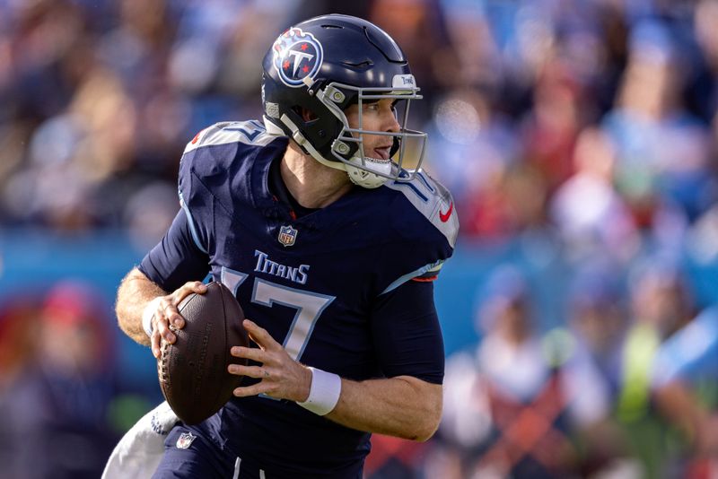 Tennessee Titans quarterback Ryan Tannehill (17) rolls out to pass during their NFL football game against the Seattle Seahawks Sunday, Dec. 24, 2023, in Nashville, Tenn. (AP Photo/Wade Payne)