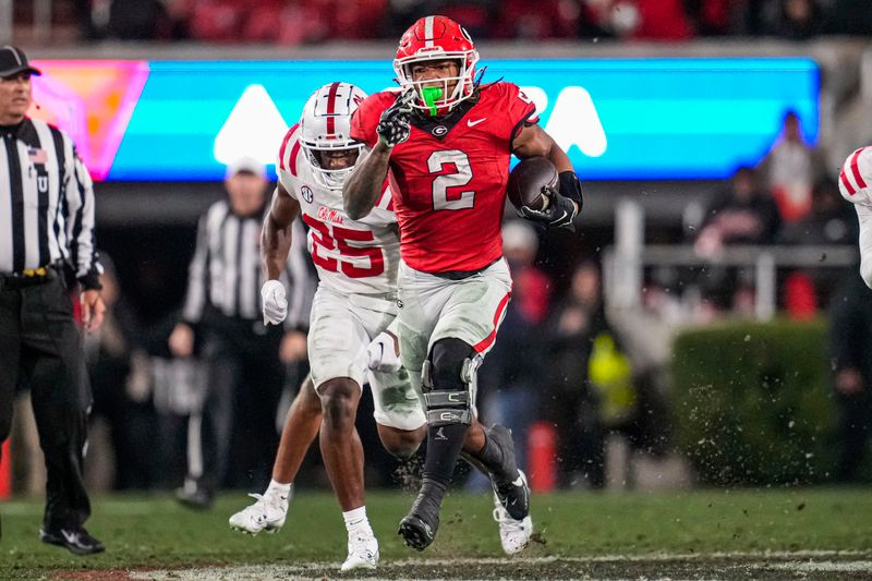 Nov 11, 2023; Athens, Georgia, USA; A Georgia Bulldogs running back Kendall Milton (2) breaks a long run against the Mississippi Rebels during the second half at Sanford Stadium. Mandatory Credit: Dale Zanine-USA TODAY Sports