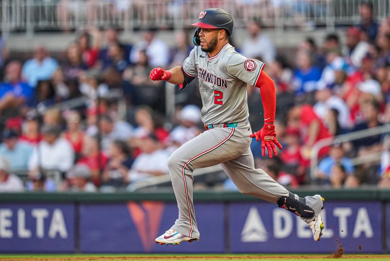 May 29, 2024; Cumberland, Georgia, USA; Washington Nationals second baseman Luis Garcia Jr. (2) runs after a hit and an error advanced him to third base against the Atlanta Braves during the second inning at Truist Park. Mandatory Credit: Dale Zanine-USA TODAY Sports