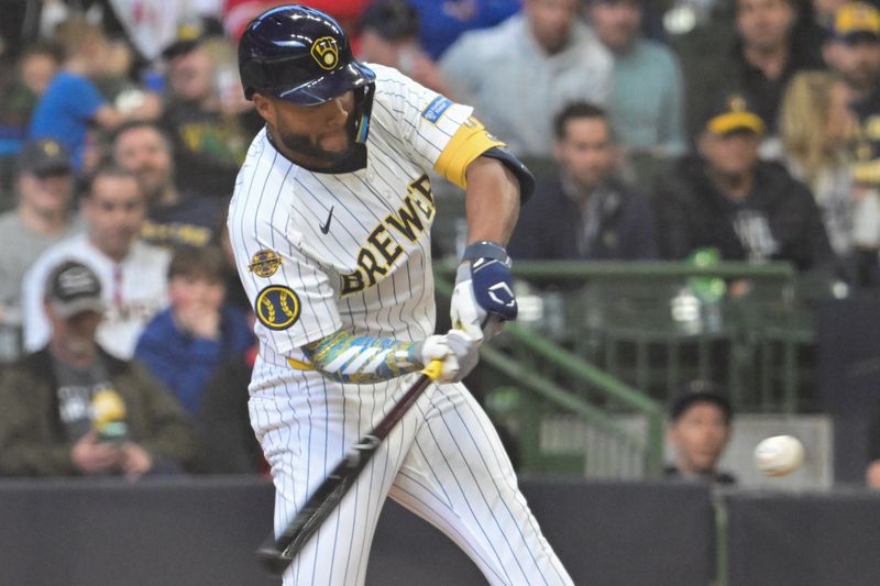 Apr 6, 2025; Milwaukee, Wisconsin, USA; Milwaukee Brewers left fielder Jackson Chourio (11) hits a solo home run in the seventh inning against the Cincinnati Reds at American Family Field. Mandatory Credit: Benny Sieu-Imagn Images