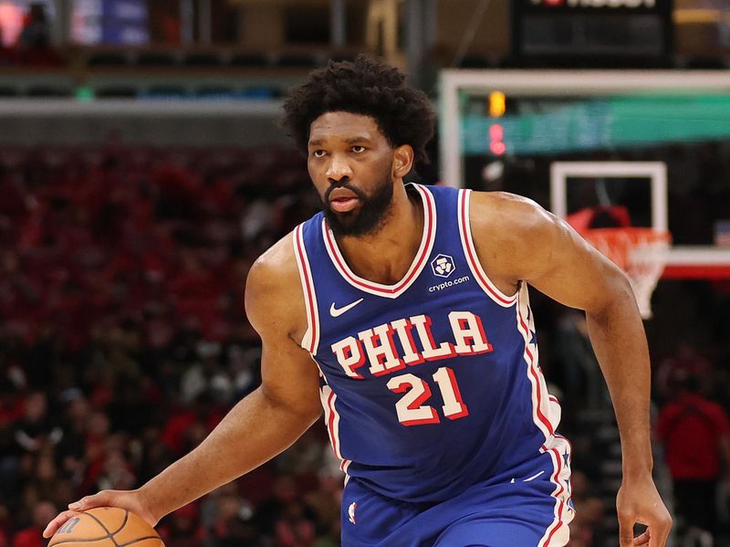 CHICAGO, ILLINOIS - DECEMBER 08: Joel Embiid #21 of the Philadelphia 76ers dribbles against the Chicago Bulls during the first half at the United Center on December 08, 2024 in Chicago, Illinois. NOTE TO USER: User expressly acknowledges and agrees that, by downloading and or using this photograph, User is consenting to the terms and conditions of the Getty Images License Agreement.  (Photo by Michael Reaves/Getty Images)